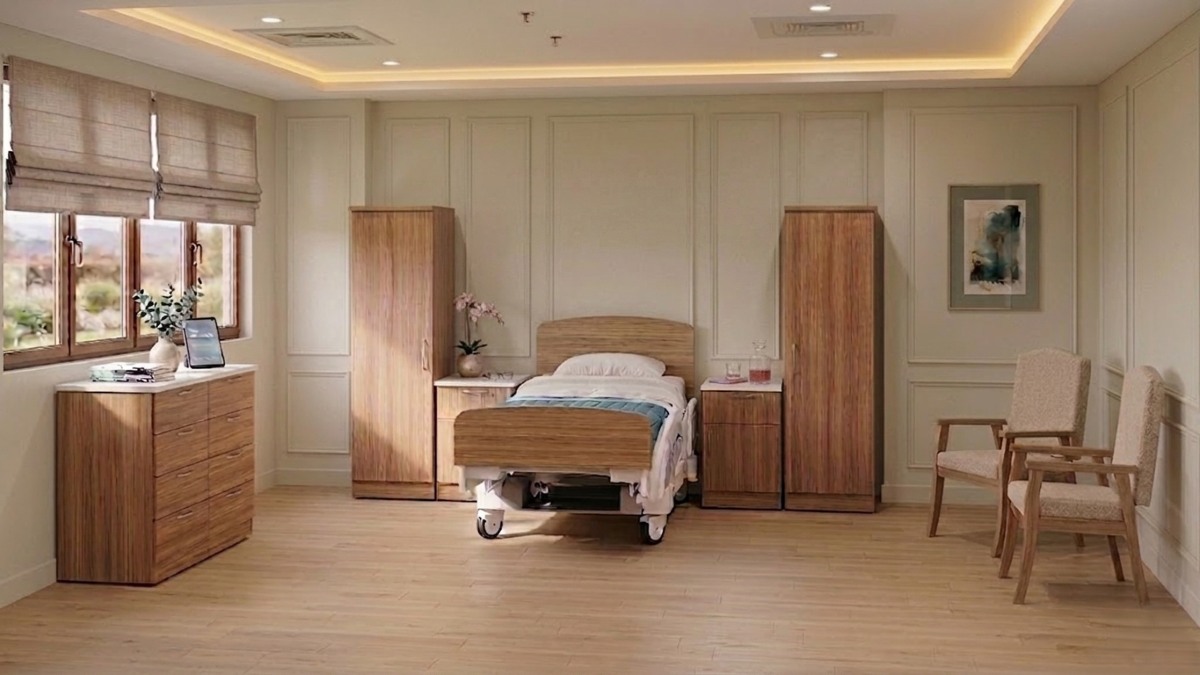 A resident room furnished with IntelliCare 100 Series wardrobes, dresser and bedside table with solid tops