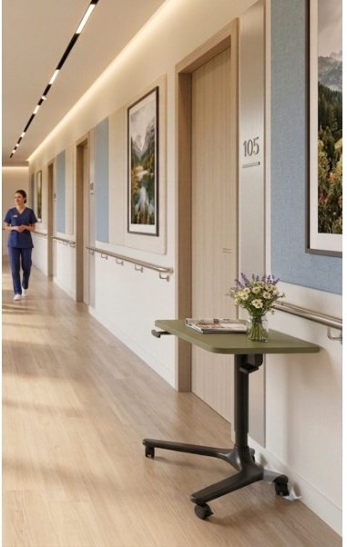 IntelliCare mobile height-adjustable table in a care-home corridor